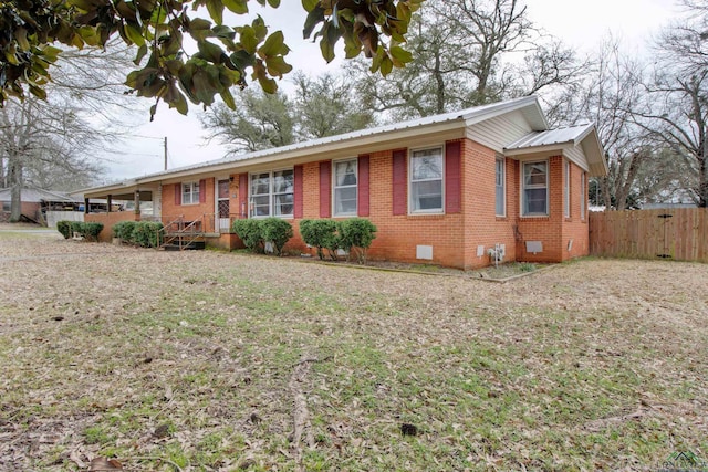 ranch-style house with a front lawn