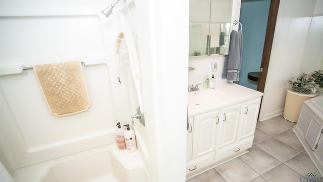 bathroom with tile patterned flooring and vanity