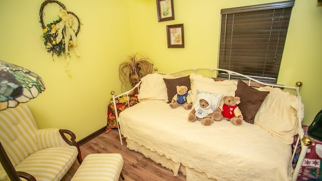 bedroom with wood-type flooring