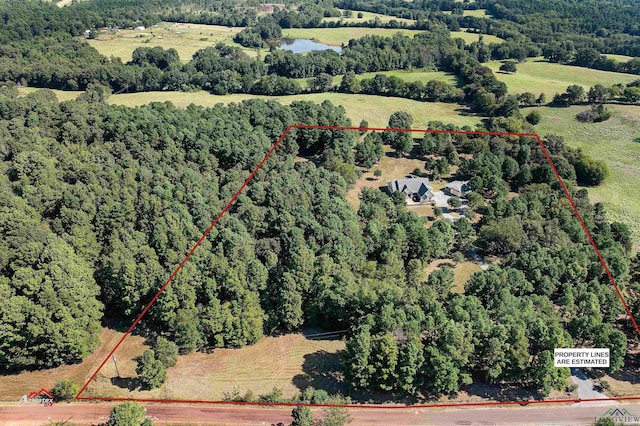 birds eye view of property featuring a water view and a rural view