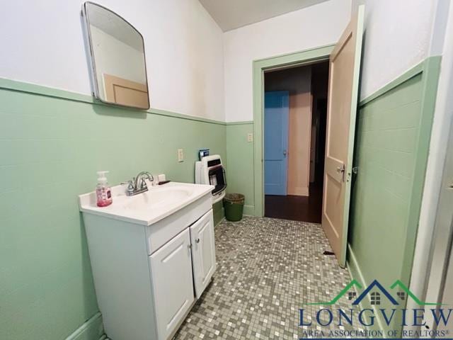 bathroom with tile patterned flooring and vanity