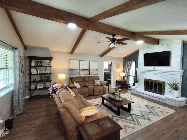 1101 N Idlewood Dr, White Oak, TX 75693 - living room featuring wood finished floors, ceiling fan, a brick fireplace, and baseboards