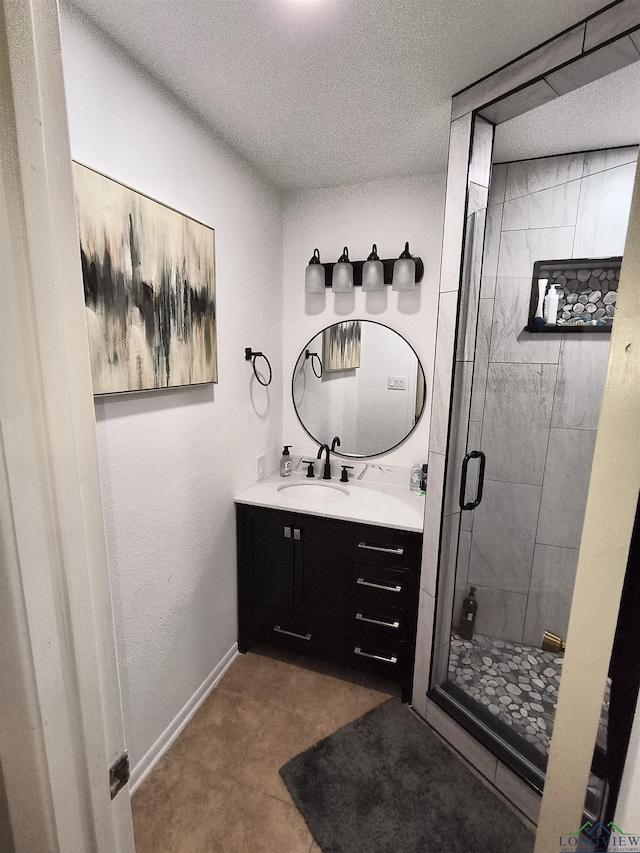 1101 N Idlewood Dr, White Oak, TX 75693 - bathroom with vanity, a stall shower, a textured ceiling, and baseboards