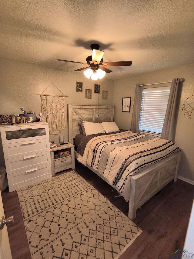 1101 N Idlewood Dr, White Oak, TX 75693 - bedroom featuring a textured ceiling and ceiling fan