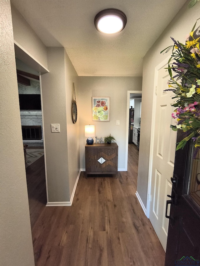 1101 N Idlewood Dr, White Oak, TX 75693 - corridor featuring wood finished floors and baseboards