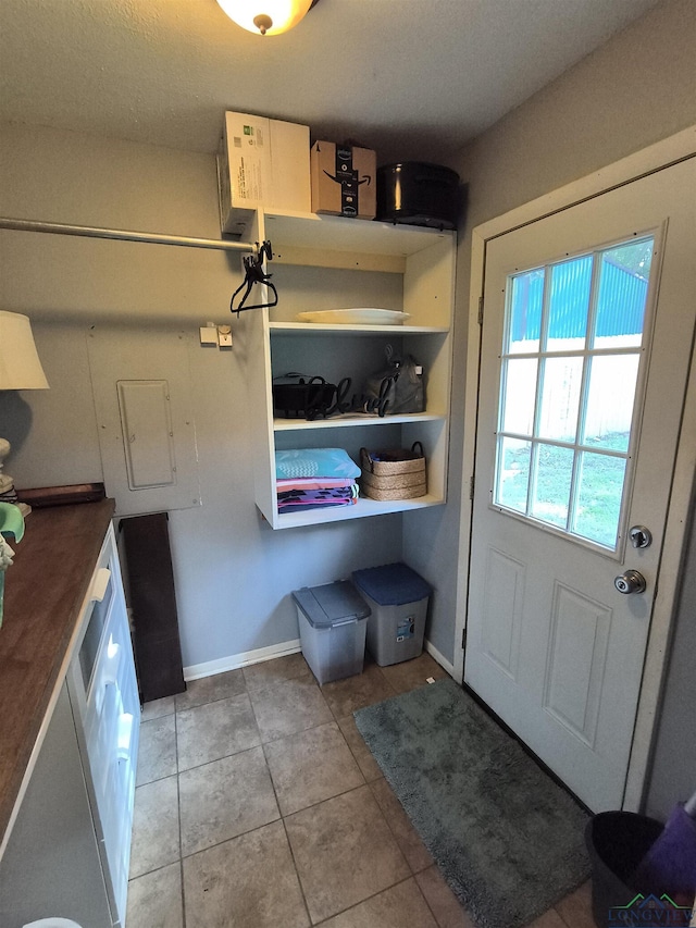 1101 N Idlewood Dr, White Oak, TX 75693 - doorway featuring baseboards and light tile patterned floors