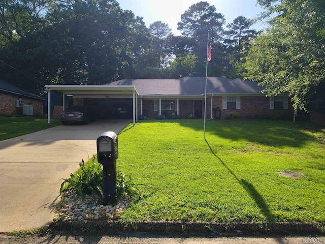1101 N Idlewood Dr, White Oak, TX 75693 - ranch-style home with a front yard, driveway, central AC, and an attached carport