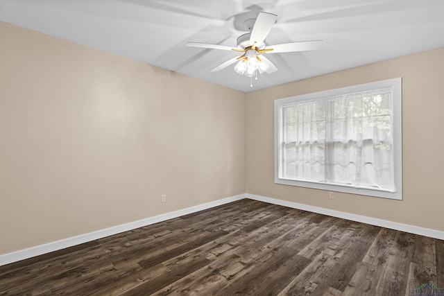813 Kenwood Ln, Longview, TX 75604 - spare room featuring baseboards, dark wood-style floors, and ceiling fan
