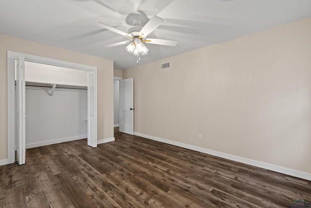 813 Kenwood Ln, Longview, TX 75604 - unfurnished bedroom featuring dark wood-type flooring, baseboards, a closet, and ceiling fan