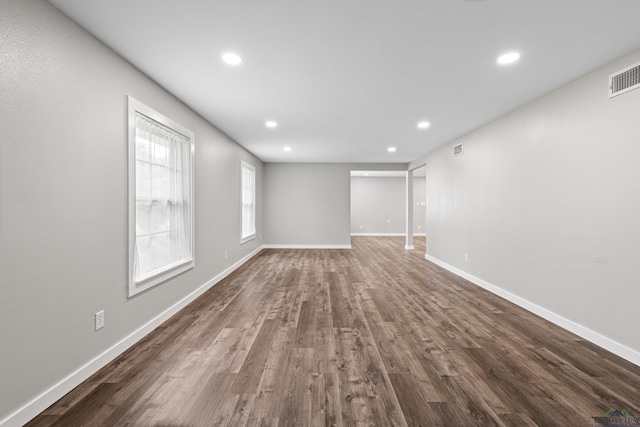813 Kenwood Ln, Longview, TX 75604 - unfurnished living room featuring recessed lighting, baseboards, and dark wood-style floors