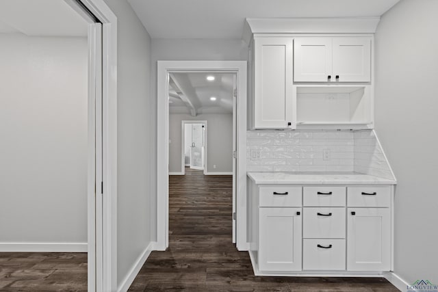 813 Kenwood Ln, Longview, TX 75604 - corridor with dark wood-style flooring and baseboards
