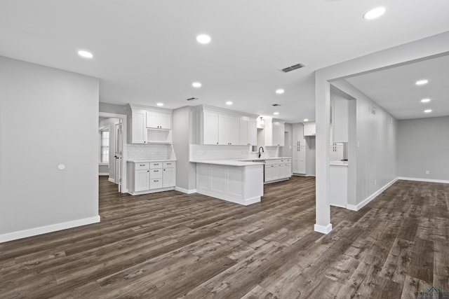 813 Kenwood Ln, Longview, TX 75604 - kitchen featuring open floor plan, baseboards, dark wood-style floors, white cabinetry, and recessed lighting
