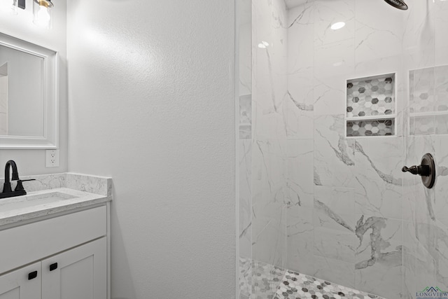 813 Kenwood Ln, Longview, TX 75604 - bathroom featuring vanity and a marble finish shower
