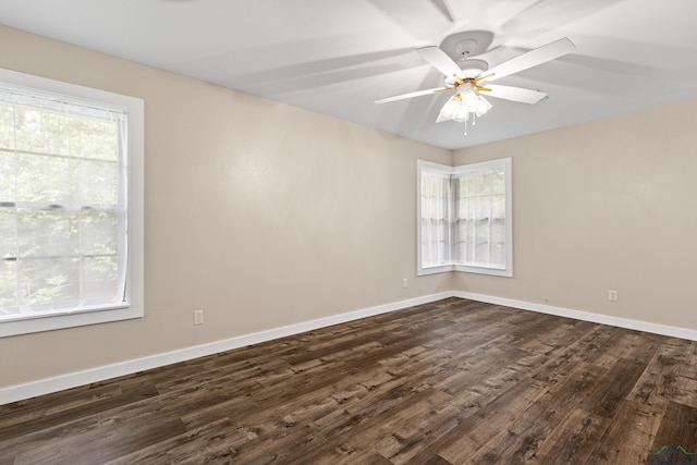813 Kenwood Ln, Longview, TX 75604 - unfurnished room with dark wood finished floors, healthy amount of natural light, and baseboards