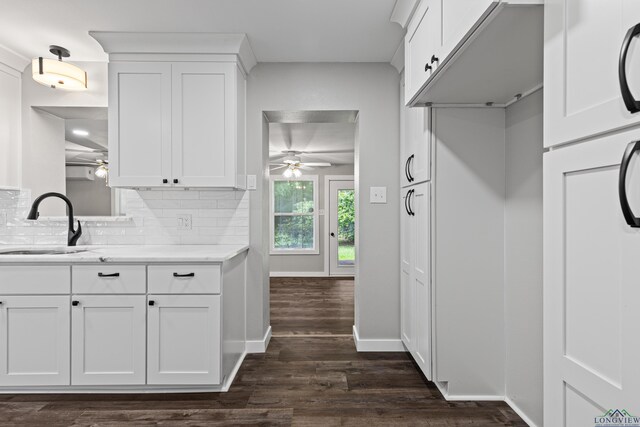 813 Kenwood Ln, Longview, TX 75604 - kitchen featuring a ceiling fan, a sink, dark wood-style flooring, and white cabinetry