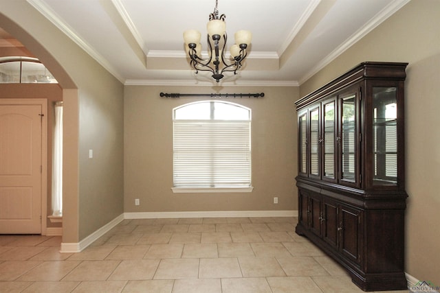 unfurnished dining area with light tile patterned floors, an inviting chandelier, and a raised ceiling