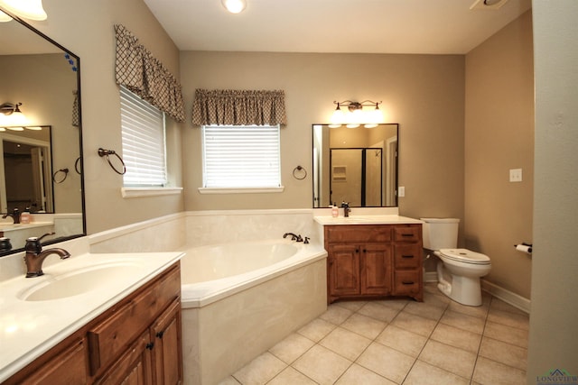 bathroom with tile patterned flooring, vanity, and independent shower and bath