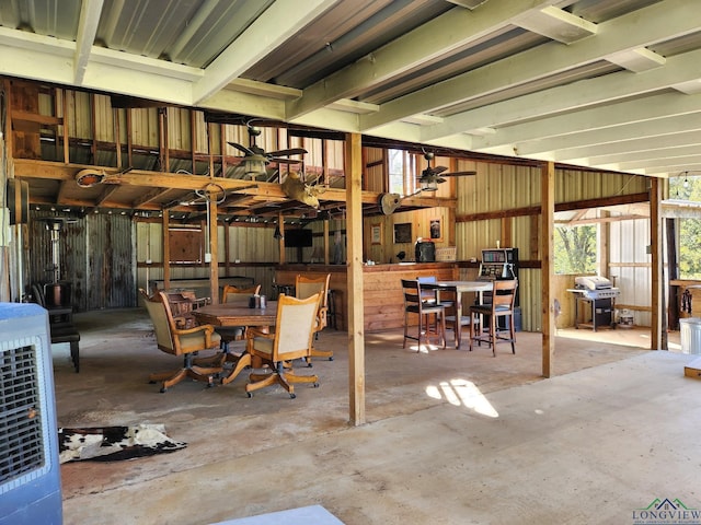 view of patio with ceiling fan and a grill