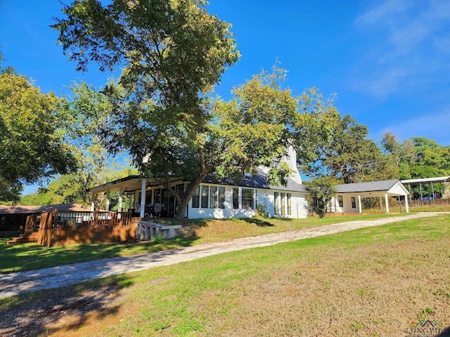 ranch-style home featuring a front yard