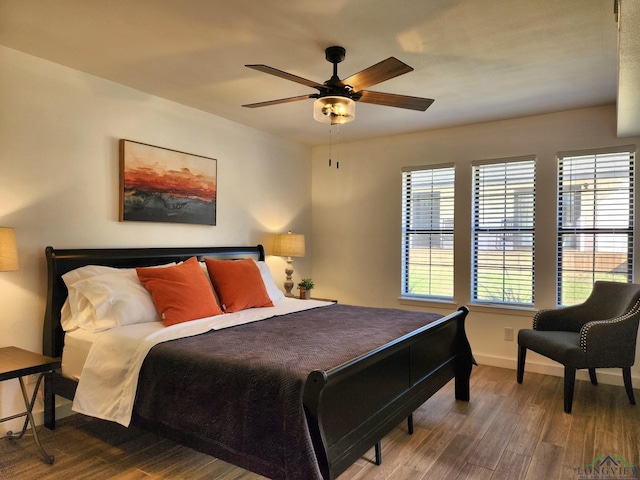 bedroom with hardwood / wood-style flooring and ceiling fan