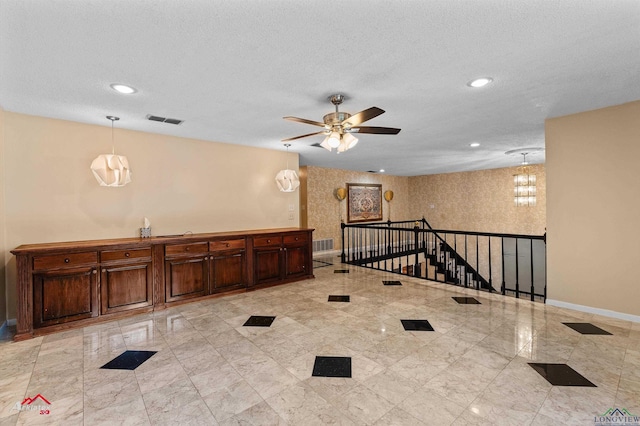 1502 Meandering Way, Longview, TX 75604 - spare room featuring baseboards, ceiling fan, recessed lighting, and a textured ceiling