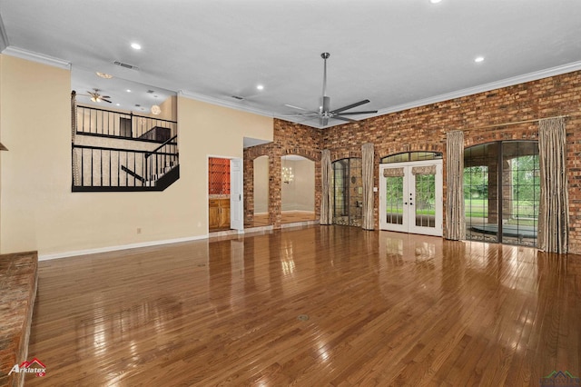 1502 Meandering Way, Longview, TX 75604 - unfurnished living room featuring a ceiling fan, crown molding, recessed lighting, arched walkways, and stairway