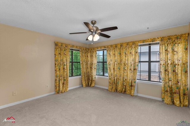 1502 Meandering Way, Longview, TX 75604 - unfurnished room featuring ceiling fan, carpet floors, a textured ceiling, and baseboards