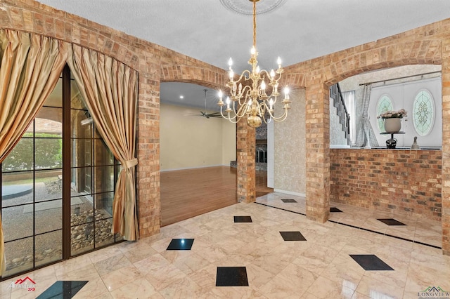 1502 Meandering Way, Longview, TX 75604 - unfurnished dining area with a chandelier, a fireplace, and arched walkways