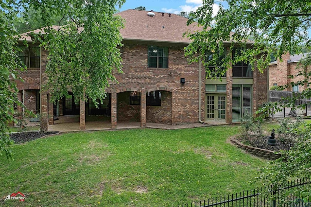 1502 Meandering Way, Longview, TX 75604 - rear view of house with french doors, a patio, brick siding, and roof with shingles