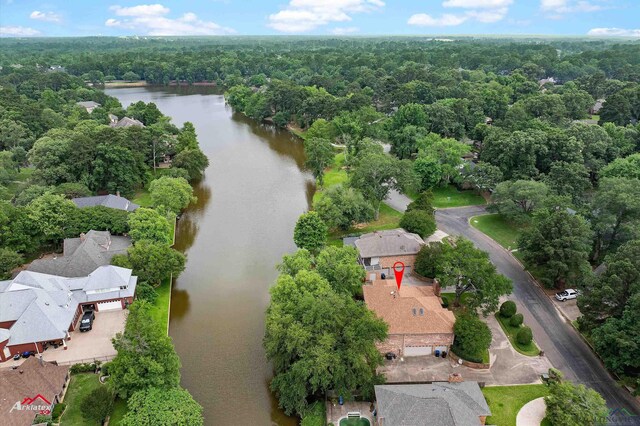 1502 Meandering Way, Longview, TX 75604 - bird's eye view of a nearby body of water and a heavily wooded area