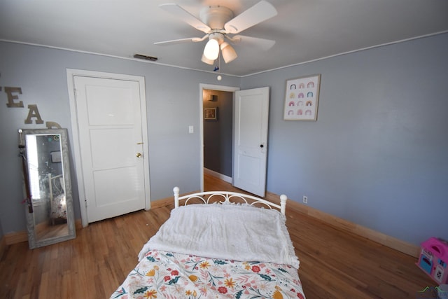 bedroom featuring hardwood / wood-style floors and ceiling fan