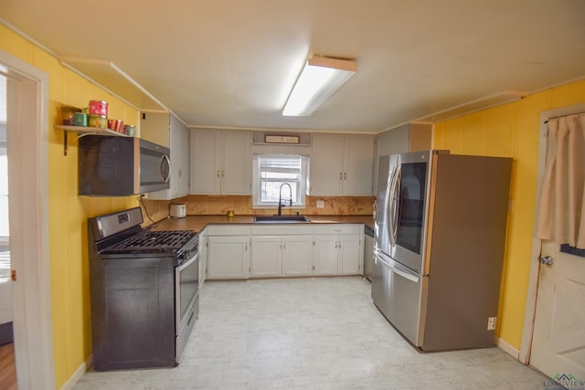 kitchen with sink and appliances with stainless steel finishes