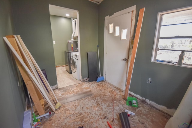 bathroom featuring a healthy amount of sunlight and washing machine and dryer