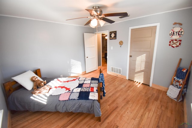 bedroom featuring ceiling fan and light wood-type flooring