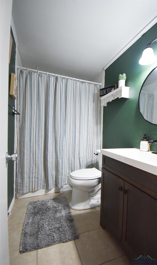 bathroom featuring walk in shower, tile patterned floors, toilet, and vanity