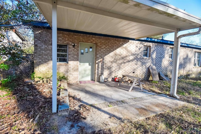 entrance to property with a patio