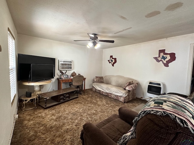 living room featuring a wall mounted air conditioner, a textured ceiling, heating unit, ceiling fan, and carpet floors