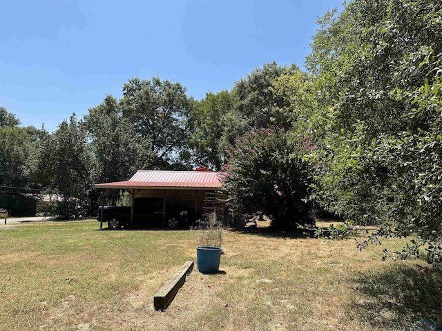 view of yard with a carport