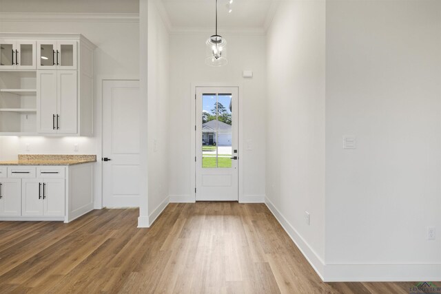 111 Mia Ln, Longview, TX 75604 - foyer entrance featuring ornamental molding, light wood-type flooring, and baseboards