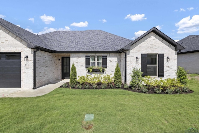 111 Mia Ln, Longview, TX 75604 - french country style house with a front lawn, an attached garage, and roof with shingles