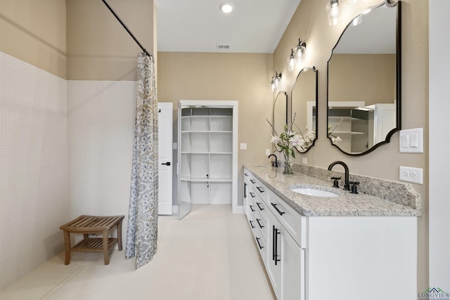 111 Mia Ln, Longview, TX 75604 - full bath with double vanity, curtained shower, and tile patterned floors