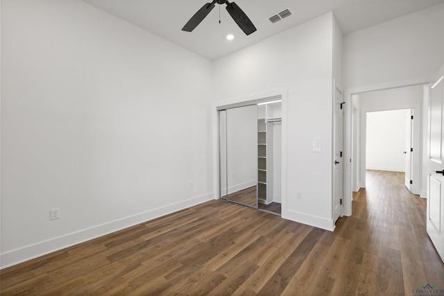 111 Mia Ln, Longview, TX 75604 - unfurnished bedroom with baseboards, wood finished floors, a closet, a towering ceiling, and recessed lighting