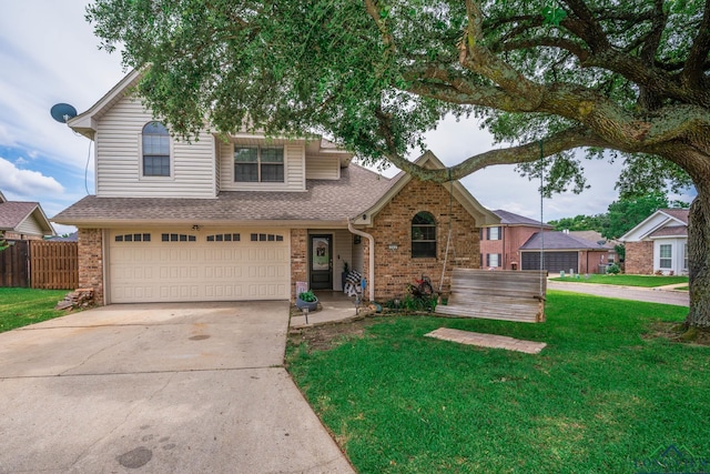202 Mill Run Dr, Longview, TX 75604 - traditional-style house featuring brick siding, a shingled roof, driveway, and an attached garage