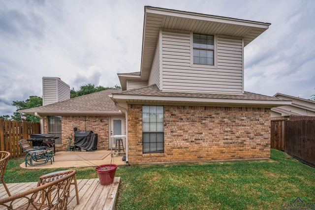 202 Mill Run Dr, Longview, TX 75604 - rear view of house with brick siding, a fenced backyard, a shingled roof, and a patio area