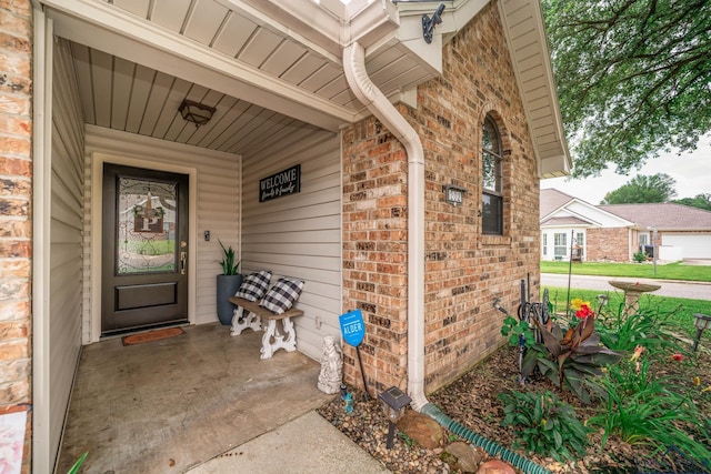 202 Mill Run Dr, Longview, TX 75604 - property entrance featuring brick siding and covered porch