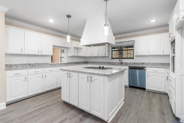 kitchen featuring premium range hood, white cabinetry, dishwasher, and pendant lighting