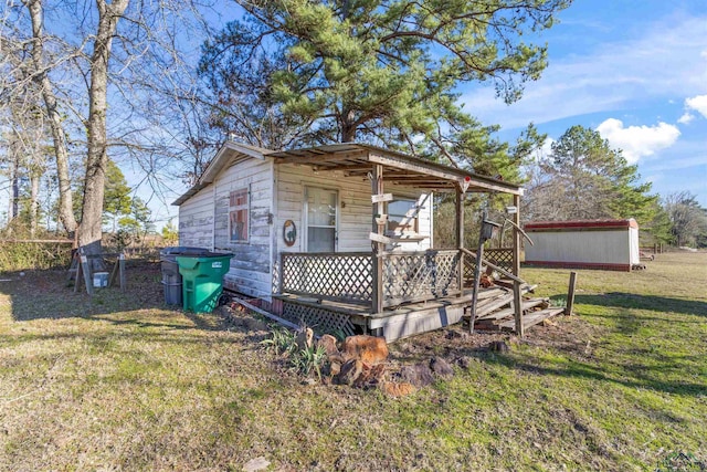 view of outbuilding with a lawn