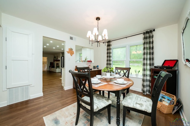 114 Fairview Dr, Longview, TX 75604 - dining space with a chandelier and wood finished floors