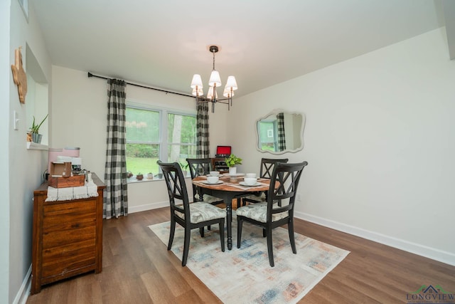114 Fairview Dr, Longview, TX 75604 - dining space featuring a chandelier and dark wood finished floors