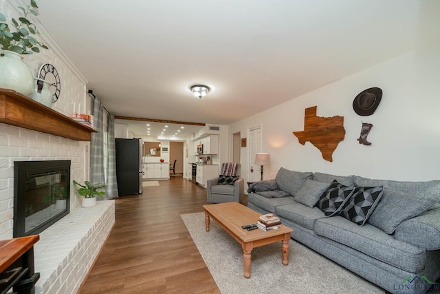 114 Fairview Dr, Longview, TX 75604 - living area with dark wood finished floors and a fireplace